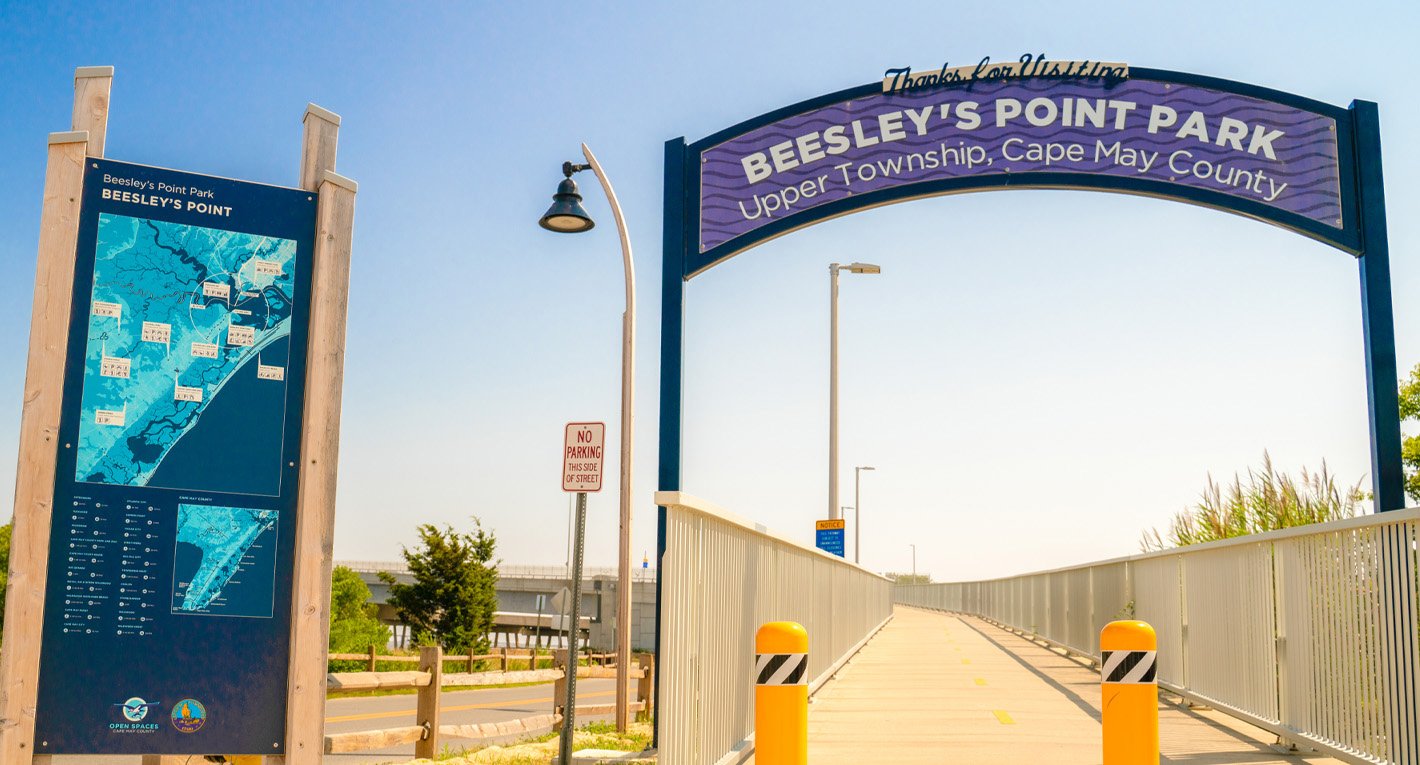 Entrance to Beesley's Point Park in Upper Township, New Jersey with pedestrian path and park map.