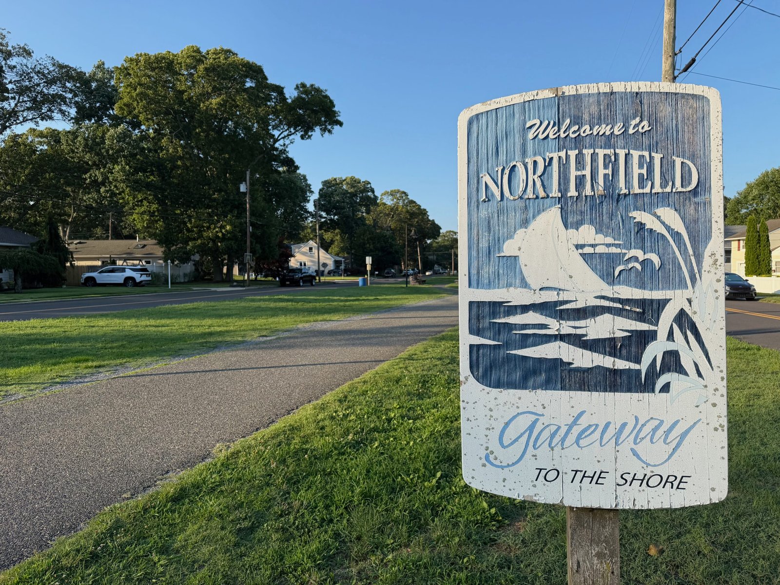 Bike path and community welcome sign in Northfield, New Jersey