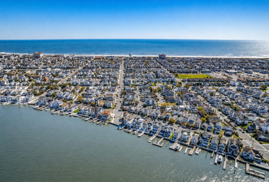 Aerial view of Ocean City NJ showing the bay, neighborhoods and beach