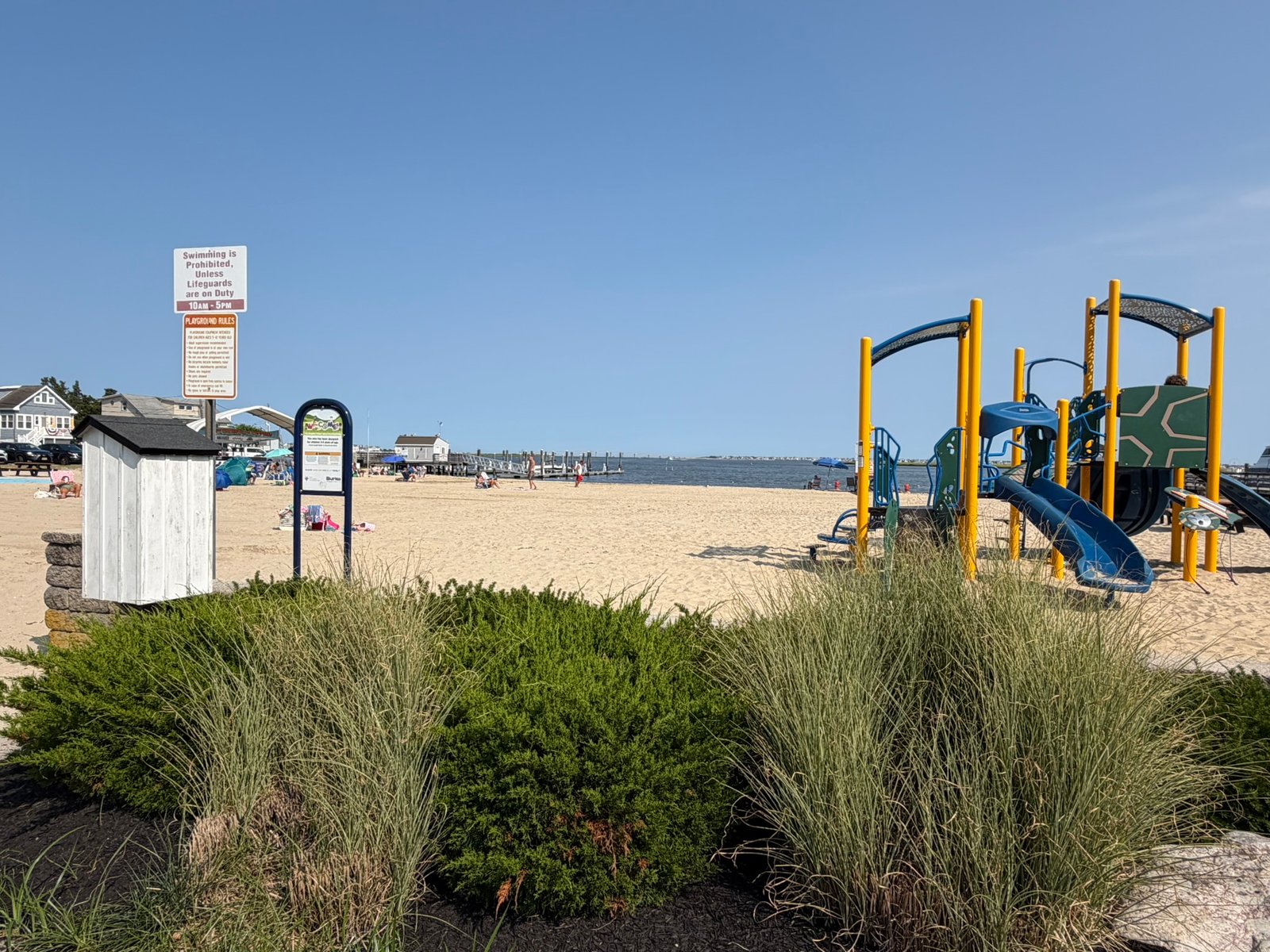 Playground and sandy bay beach along the waterfront in Somers Point, New Jersey.